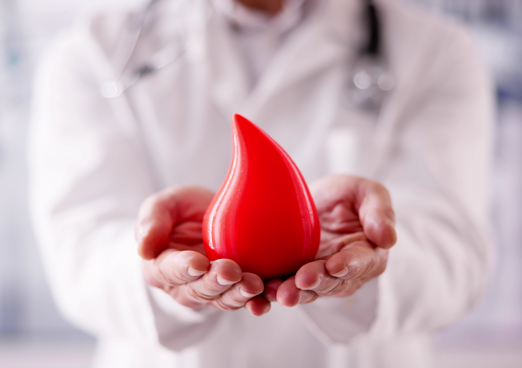 Doctor Holding a Large Drop of Blood